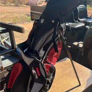 Kids Walter Hagen Black and Red Golf Stand Bag with clubs. Left handed